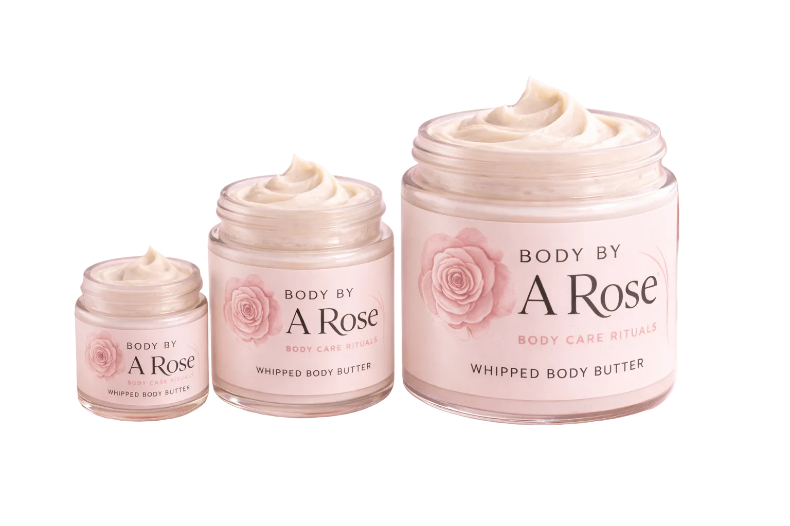 Body care products labeled 'Body by A Rose' on a pink background with flowers.